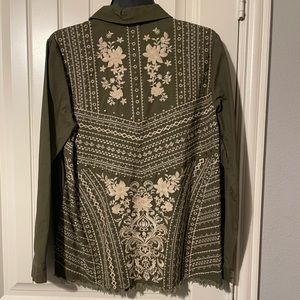 Sage colored blouse with embroidered design and brass accents